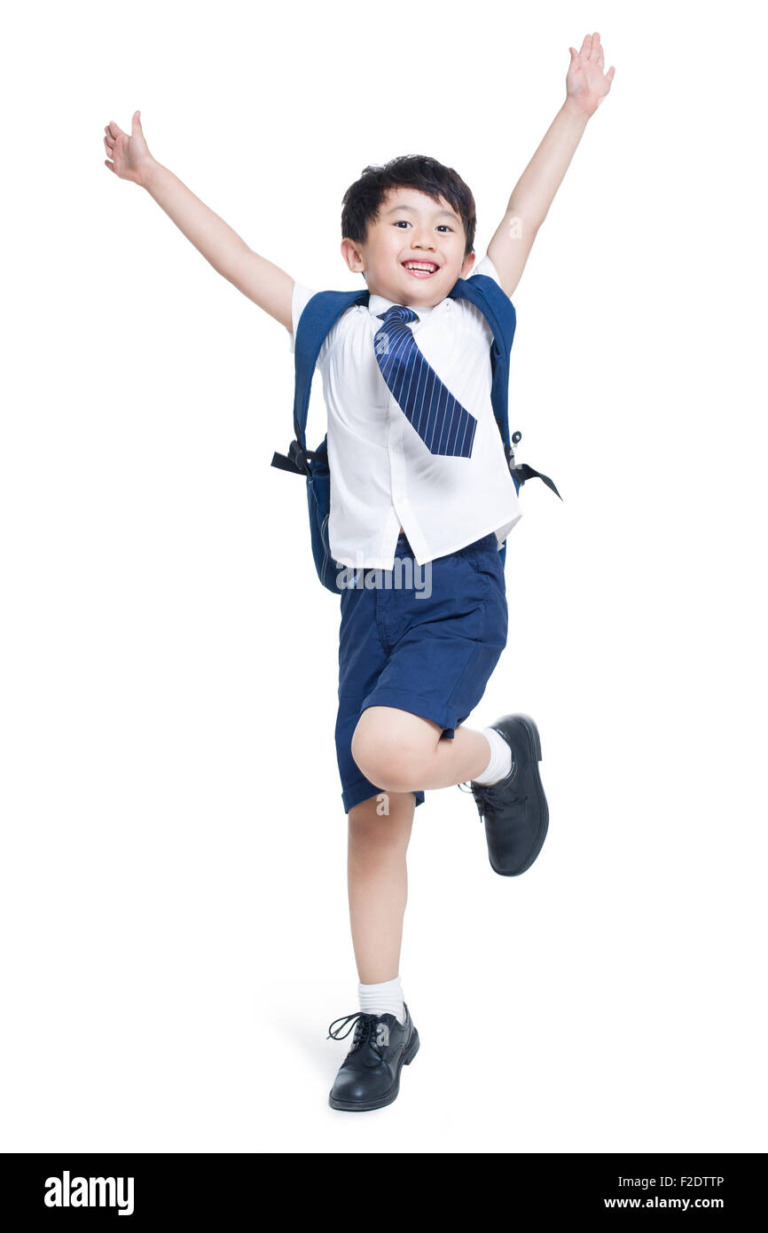 Happy schoolboy jumping Stock Photo