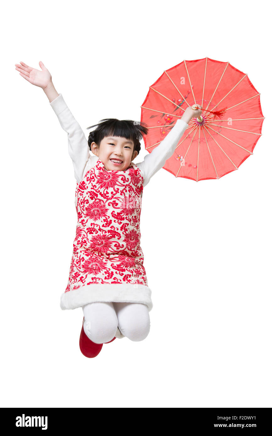Happy girl jumping with a paper umbrella Stock Photo - Alamy