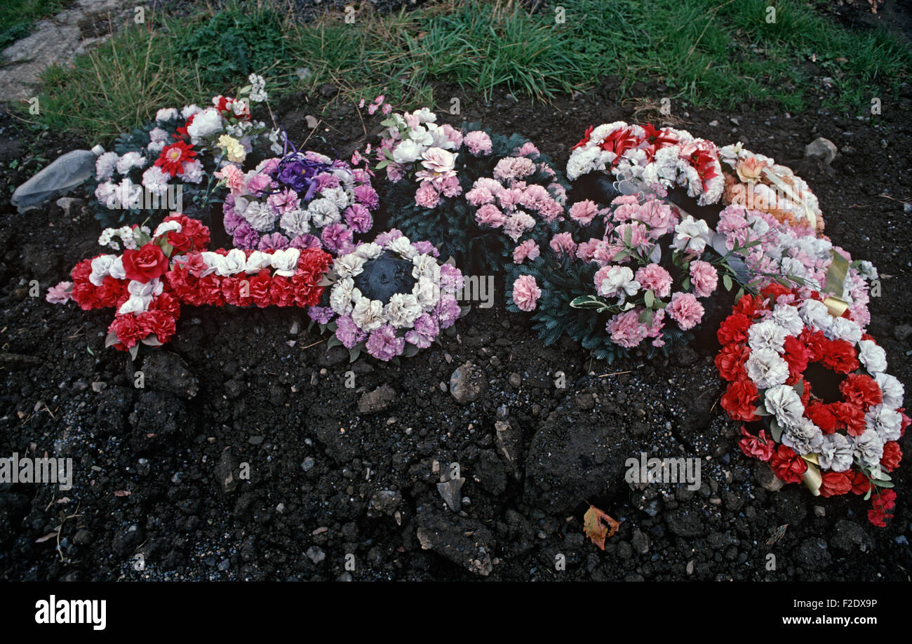 Funeral flowers on grave in Glasnevin cemetery, Dublin, referred to in  James Joyce 'Finnegans Wake', Ireland, 1993 Stock Photo - Alamy