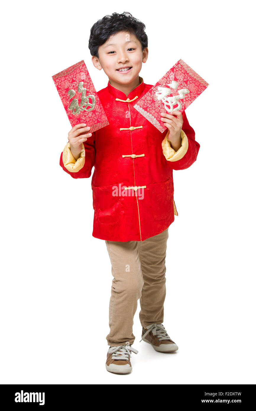 Happy boy holding two red envelopes Stock Photo