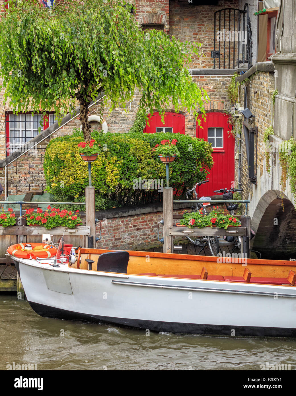 Boat on the waters of Bruges, Belgium Stock Photo
