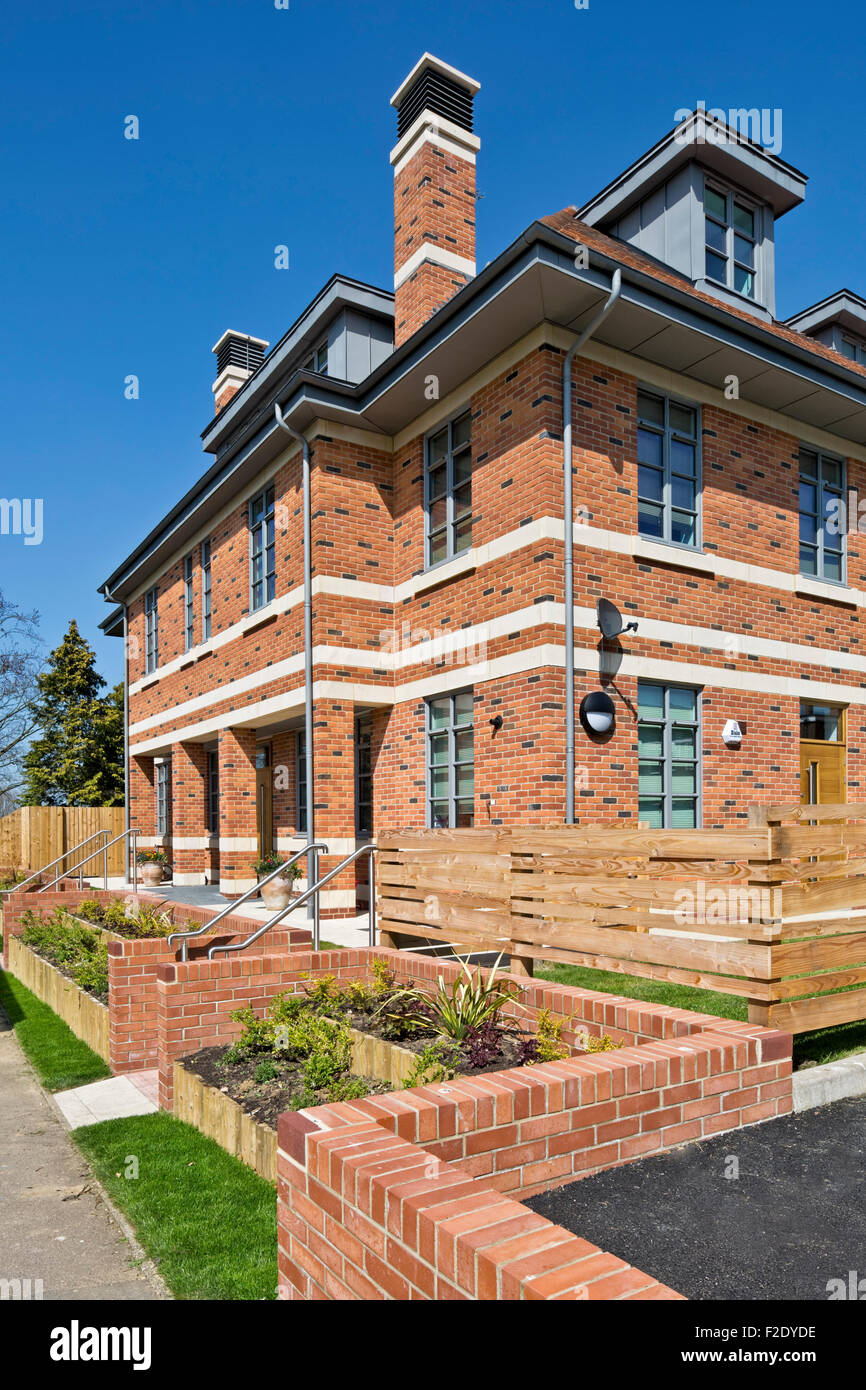 Corner elevation with garden landscaping. Felsted School Boarding House, Felsted, United Kingdom. Architect: Barnsley Hewett & M Stock Photo