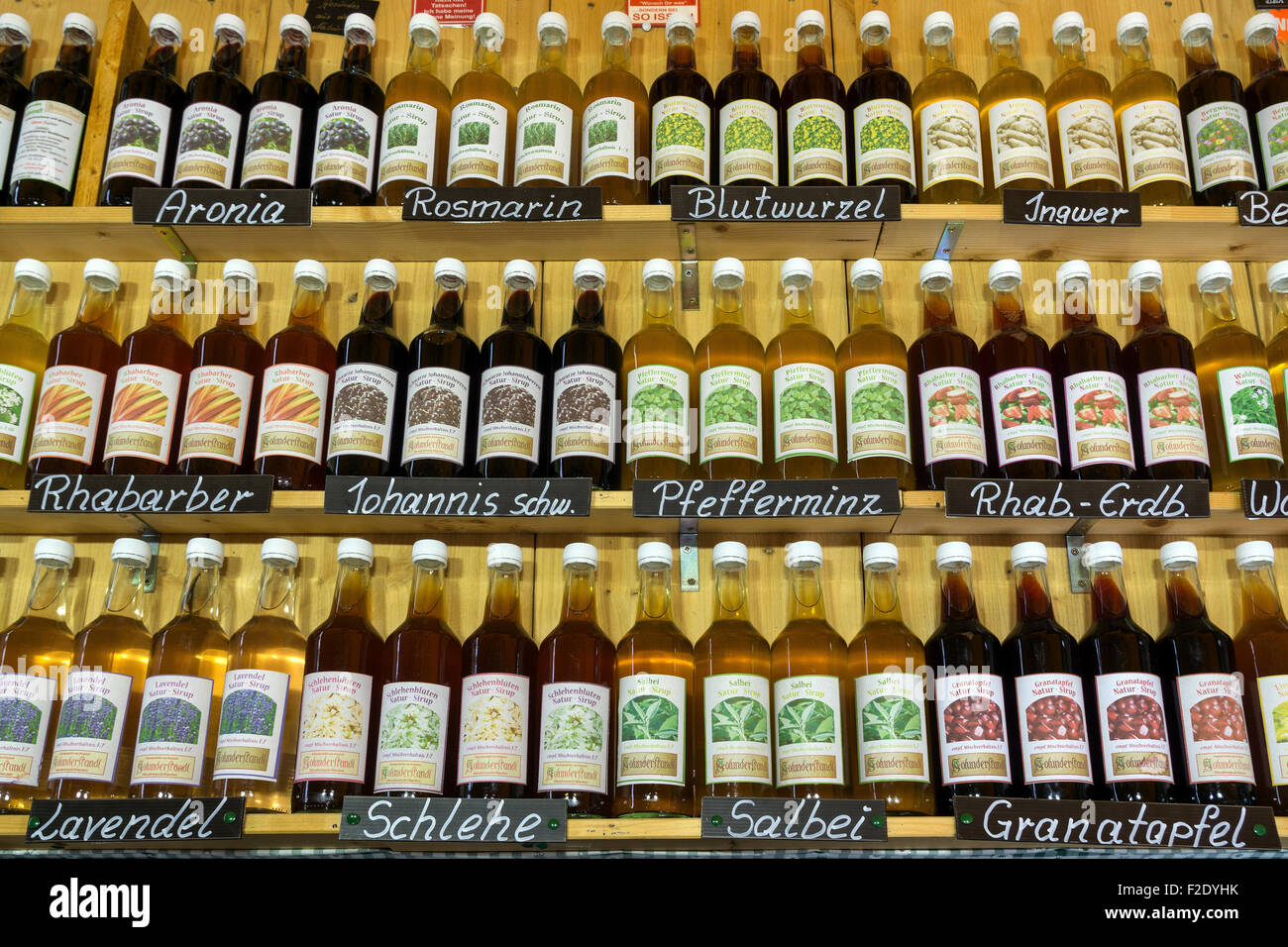 Syrups, different varieties, bottles in a stall, Vikutalienmarkt, Munich, Bavaria, Germany Stock Photo