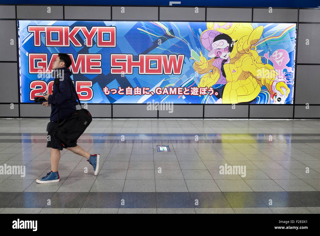 Tokyo, Japan. 17th September, 2015. Visitors walk past a Tokyo Game Show's sign on September 17, 2015, Chiba, Japan. The world's biggest trade show for video game developers brings together 480 exhibitors from 37 different countries and runs from September 17th to 20th at the International Convention Complex Makuhari Messe in Chiba. This year the exhibition registered its' highest number of exhibitors ever, with 2,009 booths showing some 1,283 game titles for smartphones, games consoles, PC and TV platforms. Credit:  Aflo Co. Ltd./Alamy Live News Stock Photo