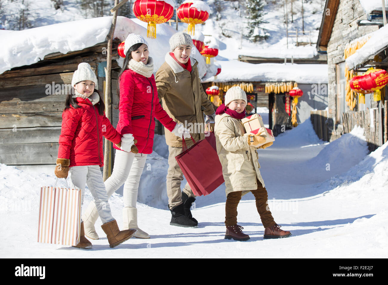 Family visiting with gifts during Chinese new year Stock Photo Alamy
