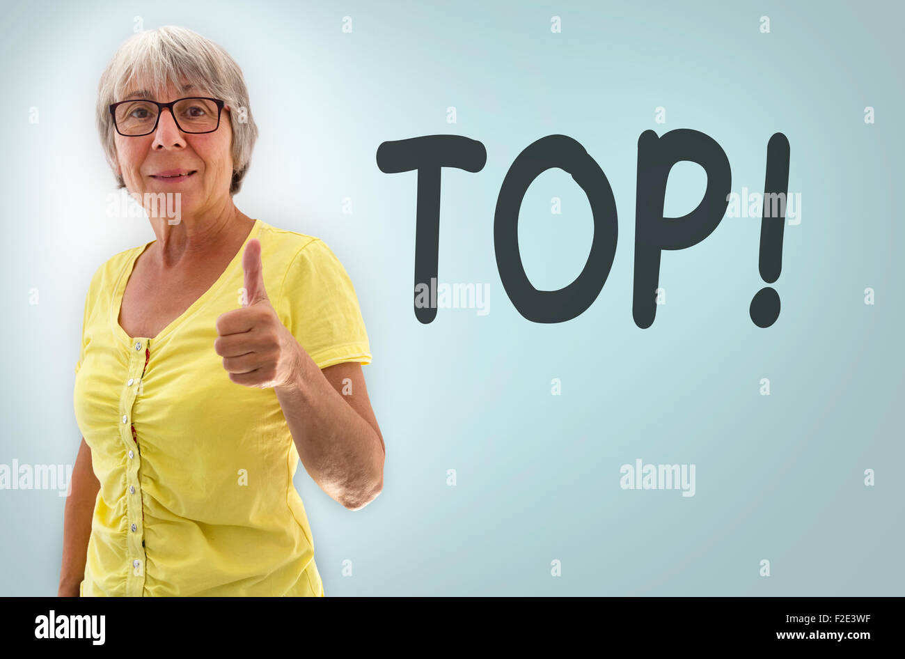 Senior woman showing thumbs up Top Concept Stock Photo