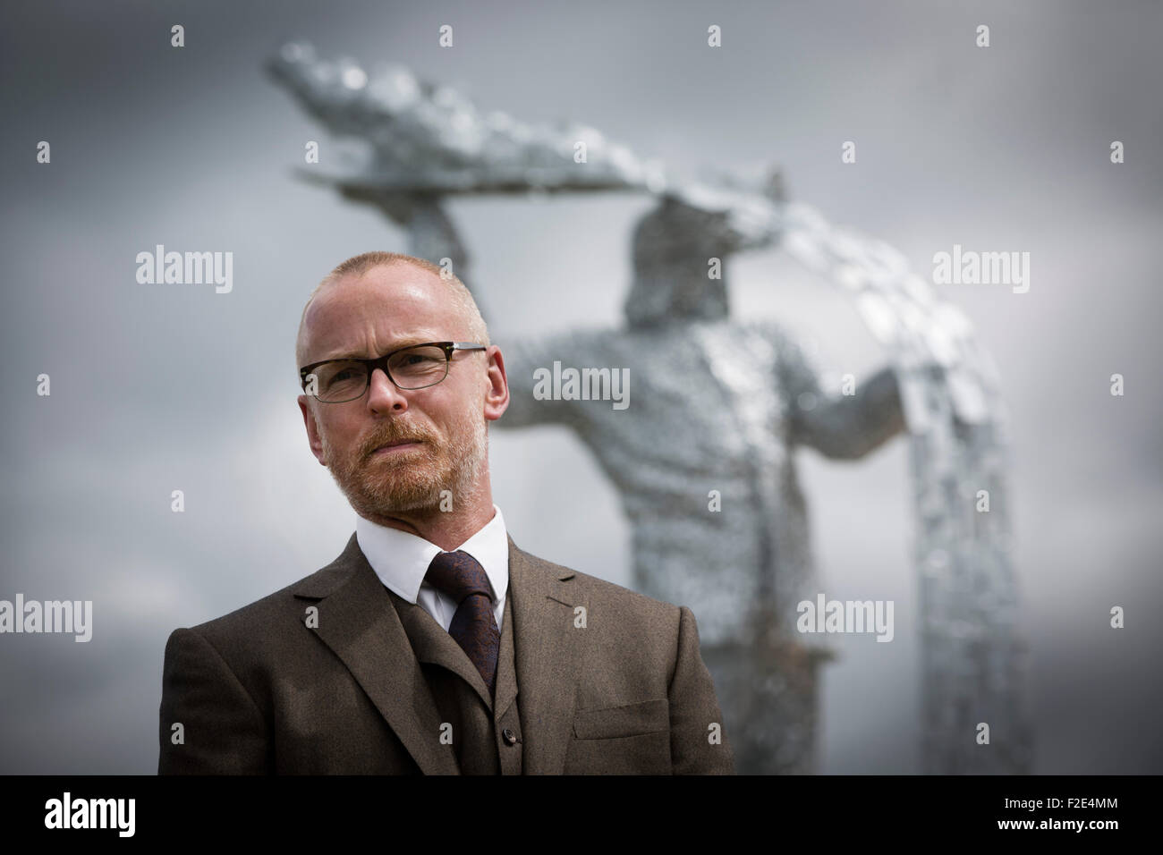 Andy Scott pictured at the official unveiling of Steel Man, his new sculpture made to commemorate those who lost their lives in the iron and steel industry in Scotland. The memorial was sited at Ravenscraig in Lanarkshire, on the site of Europe's largest former hot strip mill, which closed in 1992. The site was cleared in 1996 and now houses a sports centre, college and housing. Stock Photo