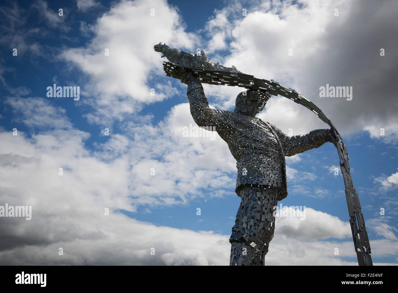 Steel Man, a new sculpture by Scottish artist Andy Scott, made to commemorate those who lost their lives in the iron and steel industry in Scotland. The memorial was sited at Ravenscraig in Lanarkshire, on the site of Europe's largest former hot strip mill, which closed in 1992. The site was cleared in 1996 and now houses a sports centre, college and housing. Stock Photo