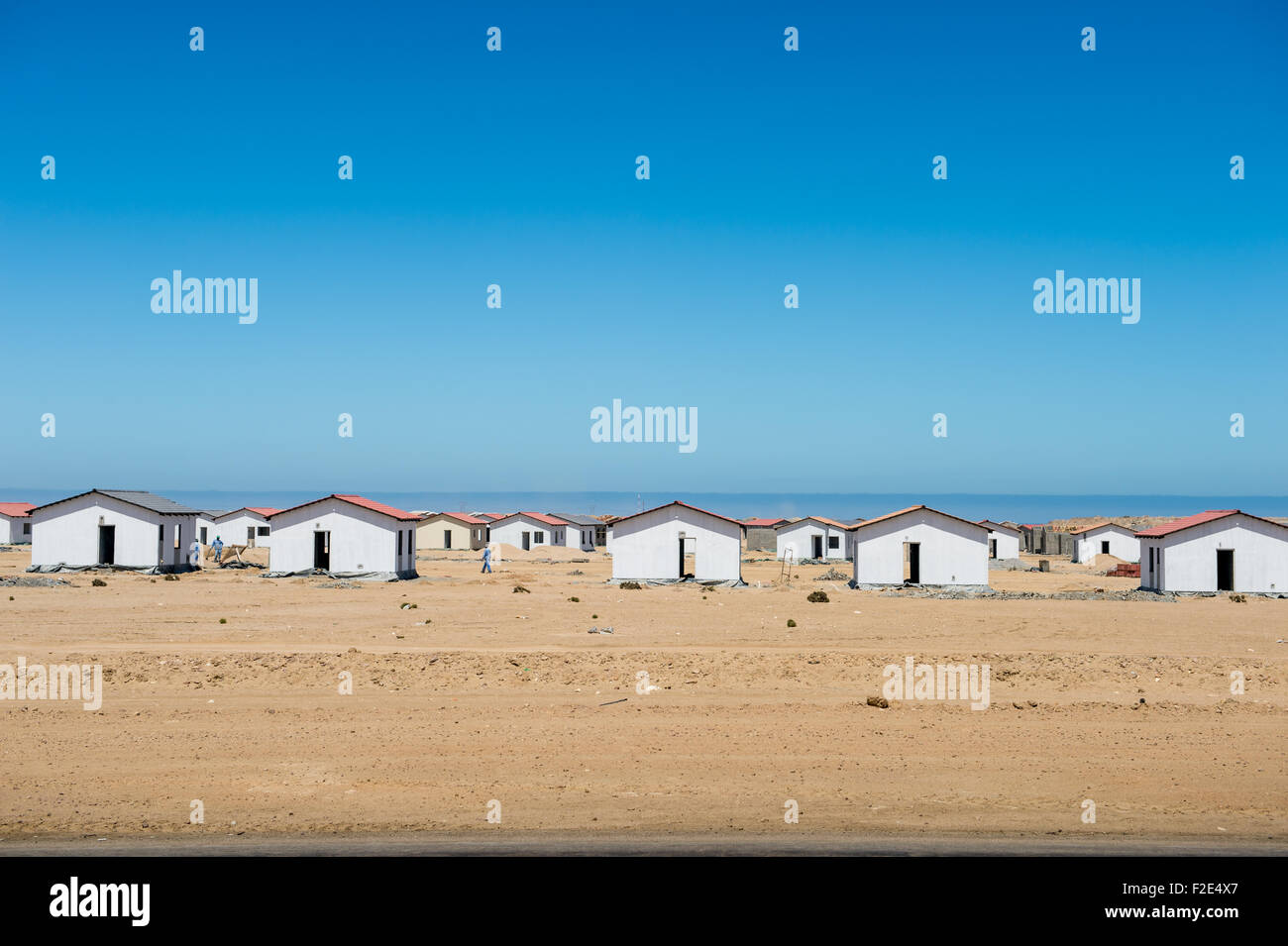 Small houses on the coast in Namibia, Africa Stock Photo