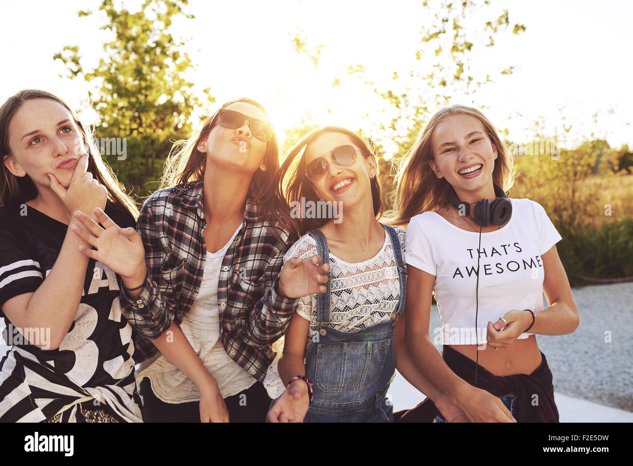 Teenagers having fun on a summer day, sun flare Stock Photo