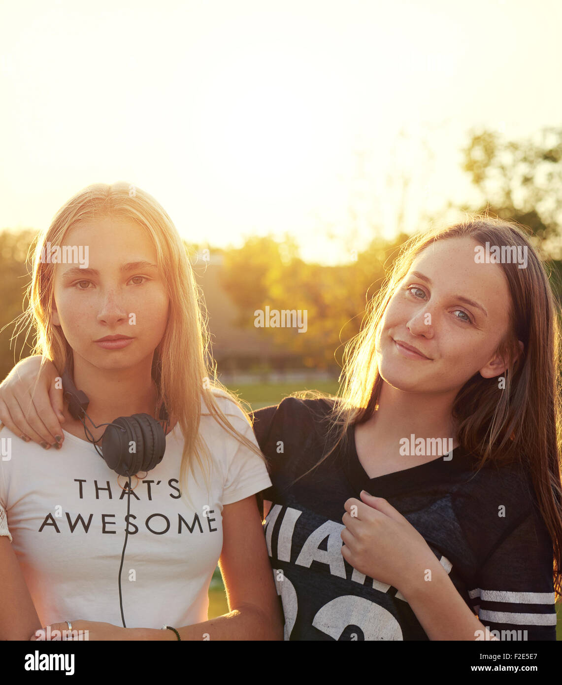 Two teenage girls outside a summer evening Stock Photo