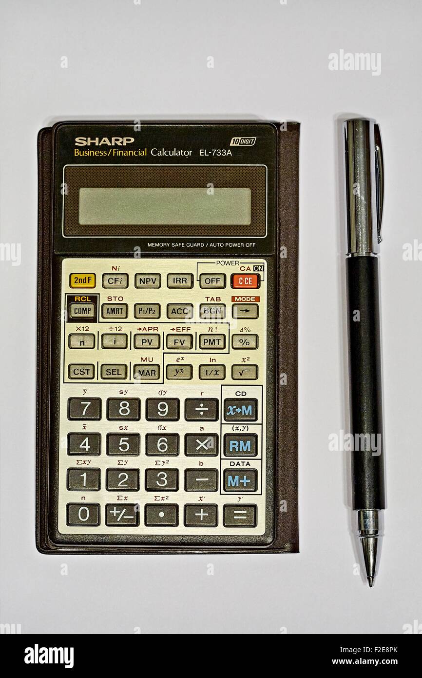 Sharp Business Financial Calculator EL-733A with Faber-Castell Ambition Precious Resin Black Roller ball Pen Stock Photo