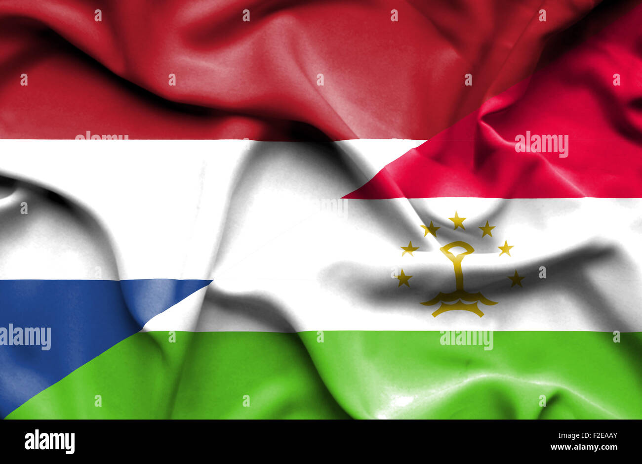 Waving flag of Tajikistan and Stock Photo