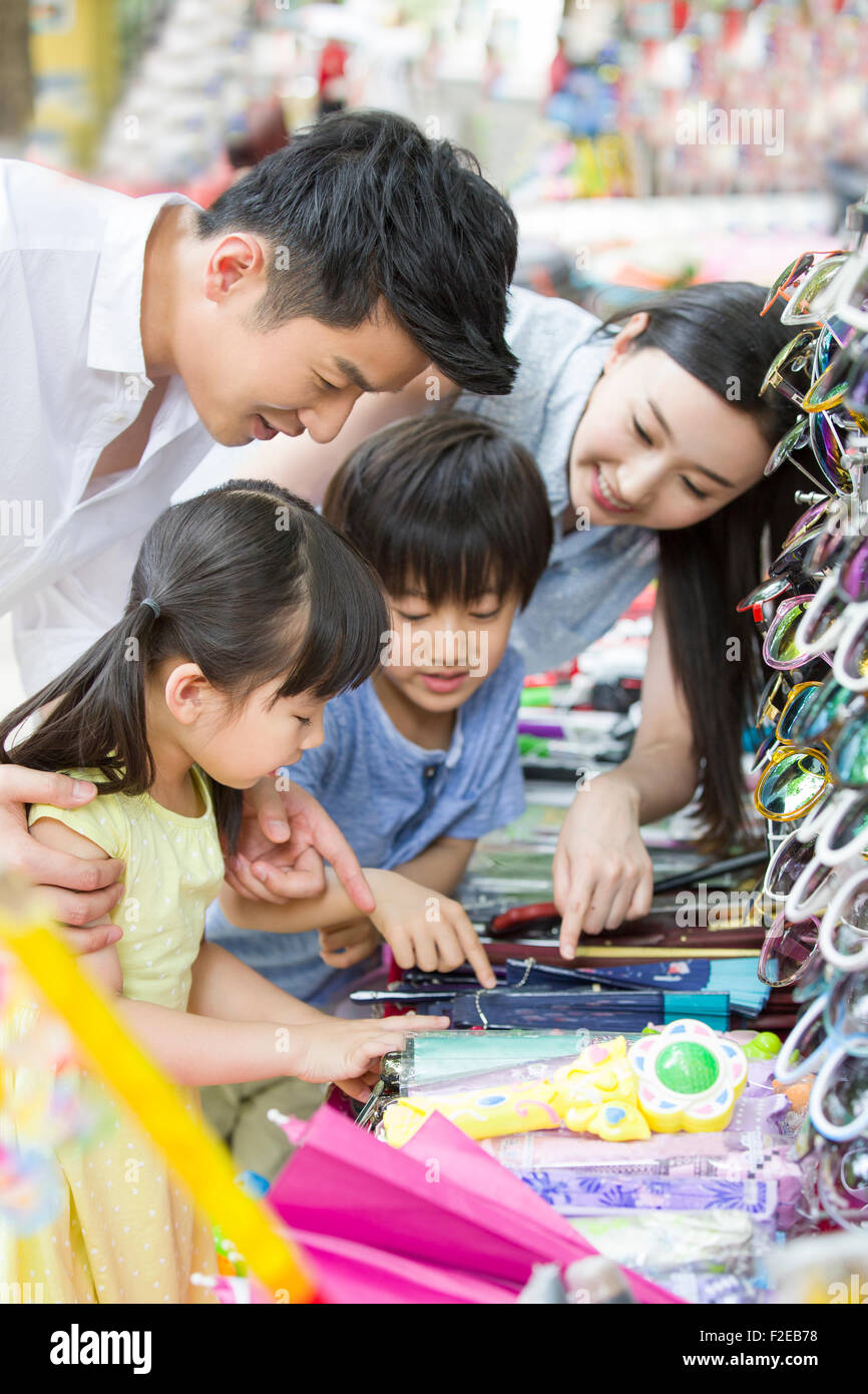 Parents and children buying toys Stock Photo Alamy
