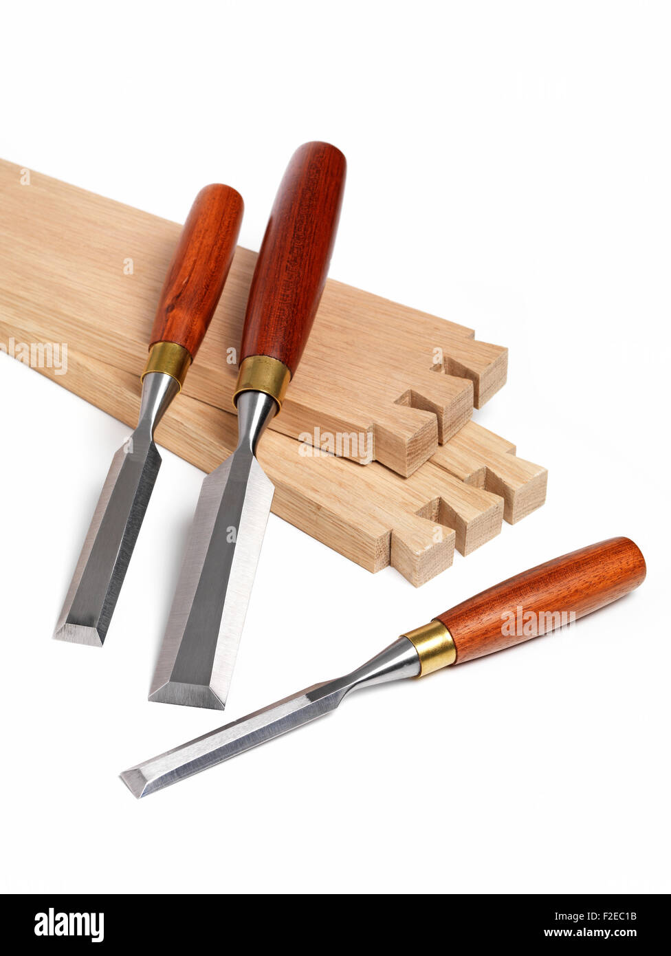 Chisel set and wood joint on white Stock Photo