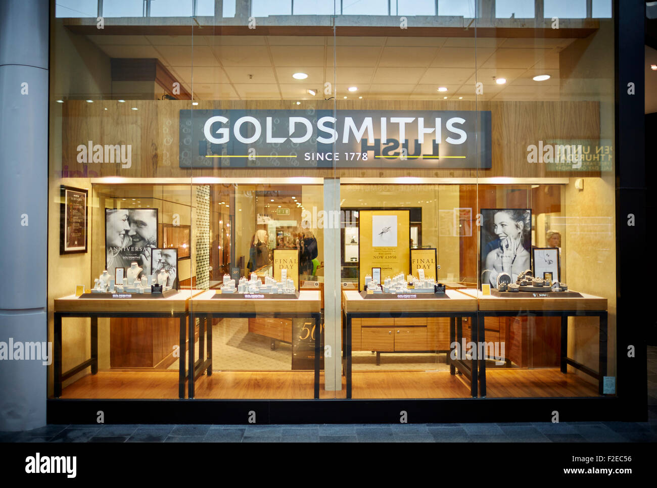 Goldsmith jewellers refurbished shop in The Mall Golden Square Shopping centre Warrington Cheshire Uk  People crowds many crowde Stock Photo