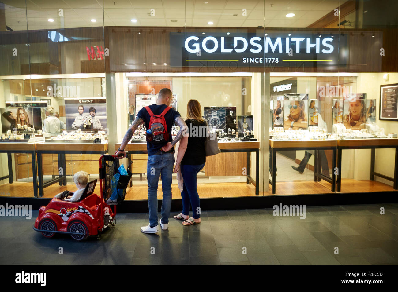 Goldsmith jewellers refurbished shop in The Mall Golden Square Shopping centre Warrington Cheshire Uk  People crowds many crowde Stock Photo