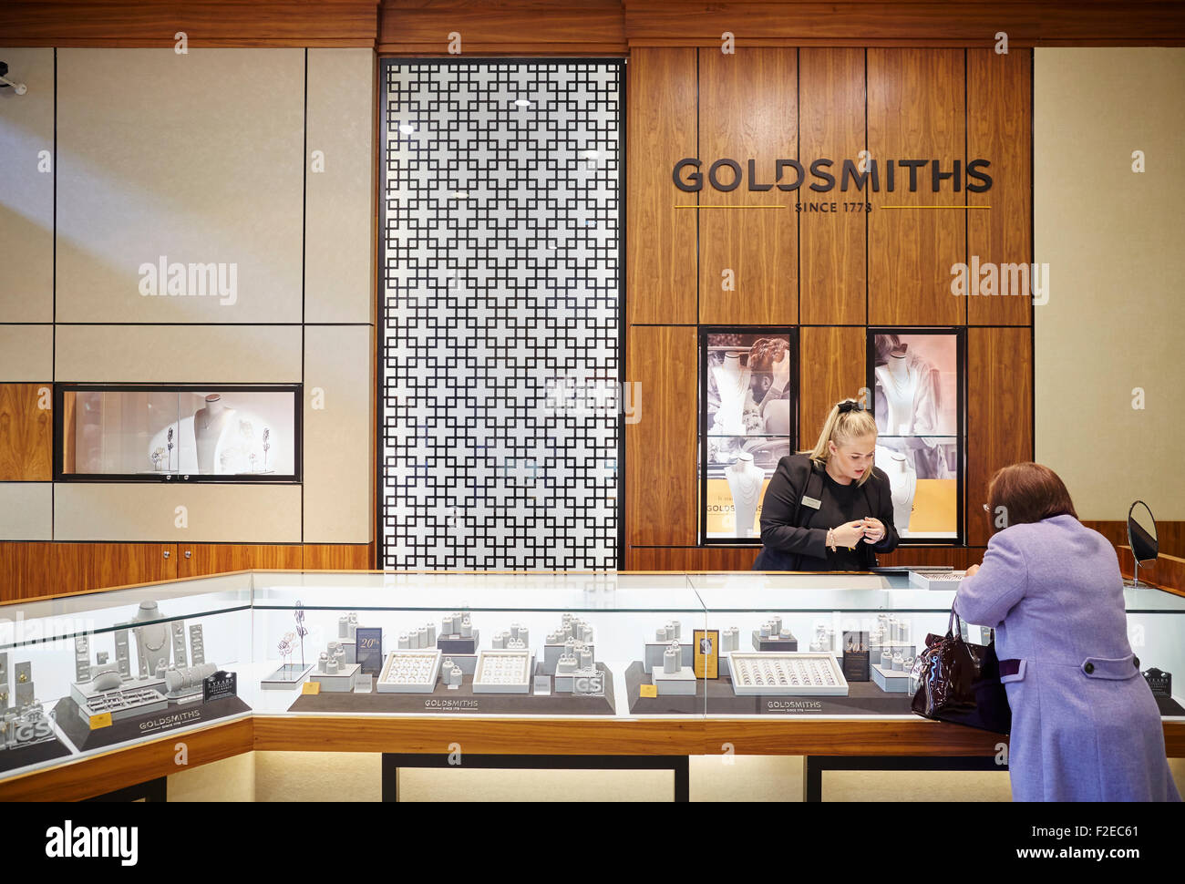 Goldsmith jewellers refurbished shop in The Mall Golden Square Shopping centre Warrington Cheshire Uk  People crowds many crowde Stock Photo