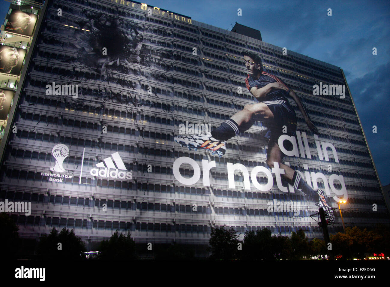 Grossplakat der Firma "Adidas" zu Zeiten der Fussballweltmeisterschaft 2014  in Brasilien auf dem Gebaeude der Berliner Verlages Stock Photo - Alamy