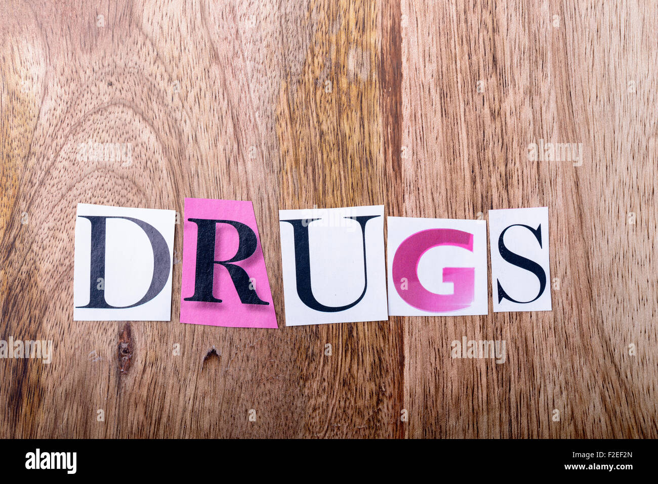 drugs written made with letters of newspaper on wood Stock Photo