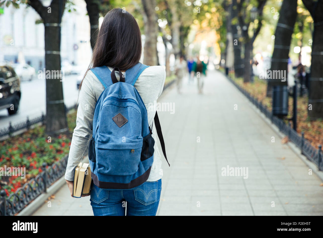 Teen girl walking rear view hi-res stock photography and images - Alamy