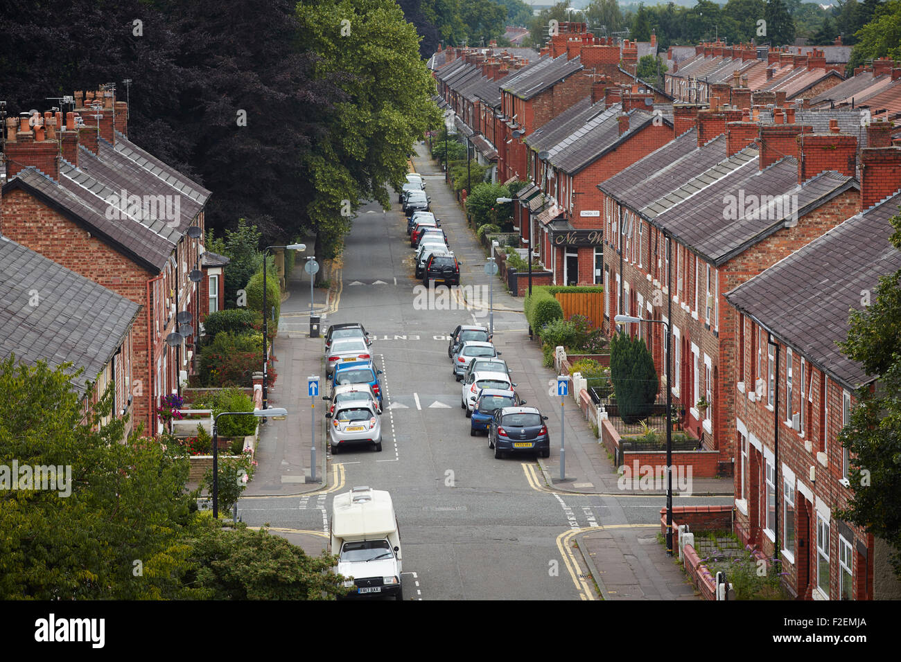 PINNINGTON LANE IN STRETFORD a street made up of terrace houses     House home place living environment building Architect dwel Stock Photo