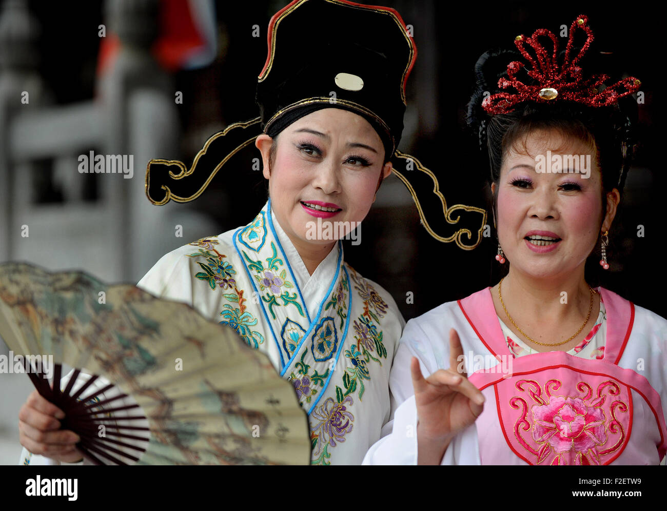 Hefei, China's Anhui Province. 17th Sep, 2015. Actors perform Luzhou opera at a drama stage in Sanhe Town of Feixi County, east China's Anhui Province, Sept. 17, 2015. Sanhe, an ancient town with a history of more than 2,500 years, has some 180 ancient buildings of Ming or Qing dynasties. Ancient streets, lanes, bridges, temples, drama stages, civilian houses or tearooms here attracted a large number of tourists from home and abroad. Credit:  Tao Ming/Xinhua/Alamy Live News Stock Photo