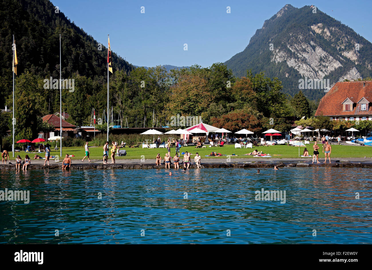 Newhaus Unterseen Switzerland sunbathing lake Europe Stock Photo