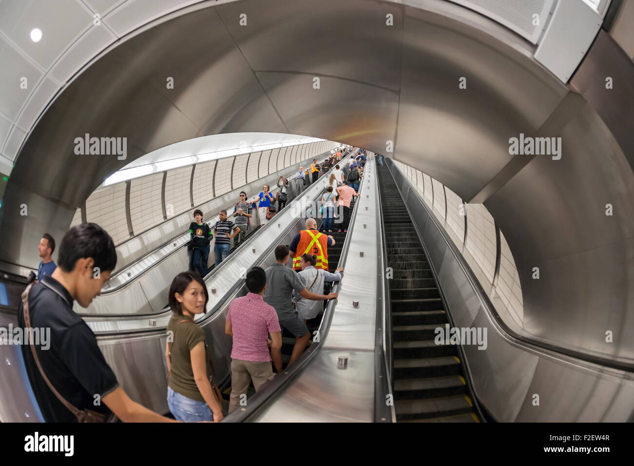 Visitors ride the escalators in the new 34th Street-Hudson Yards terminal station on the 7 Subway line extension in New York on its grand opening, Sunday, September 13, 2015.  The new tunnel from Times Square  terminates 108 feet below street level at West 34th Street and Eleventh Avenue at the doorstep of the rezoned 45 block Hudson Yards development. It is the first subway station to open in 26 years and the first line extension in 60 years. (© Richard B. Levine) Stock Photo