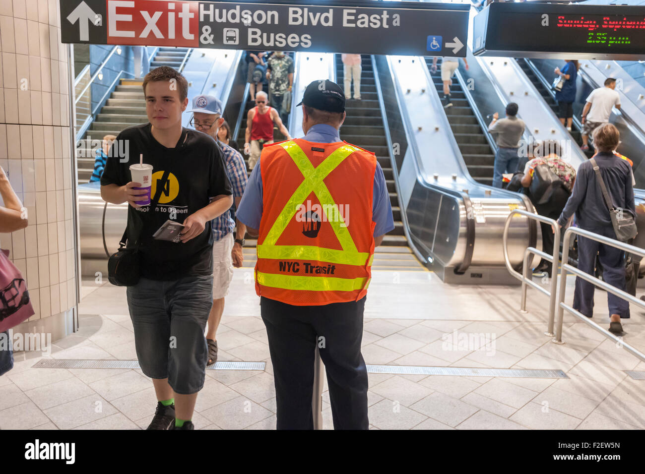 Visitors arrive in the new 34th Street-Hudson Yards terminal station on the 7 Subway line extension in New York on its grand opening, Sunday, September 13, 2015.  The new tunnel from Times Square  terminates 108 feet below street level at West 34th Street and Eleventh Avenue at the doorstep of the rezoned 45 block Hudson Yards development. It is the first subway station to open in 26 years and the first line extension in 60 years. (© Richard B. Levine) Stock Photo