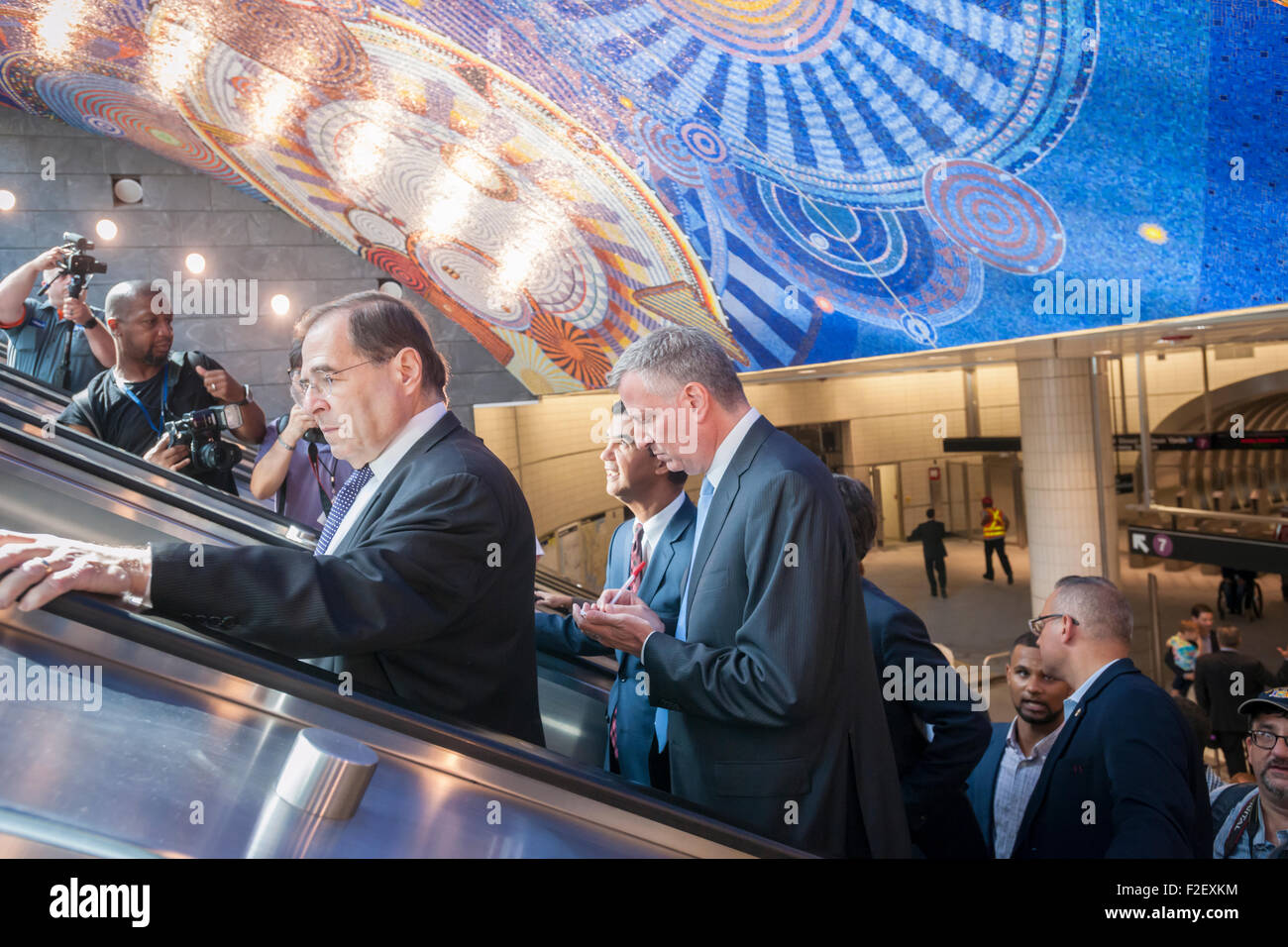 (L-R) Cong. Jerry Nadler, NYC Councilmember Ydanis Rodrguez, and New York Mayor Bill de Blasio with other officials ride the escalator at the new 34th Street-Hudson Yards terminal station on the 7 Subway line extension on its grand opening, Sunday, September 13, 2015. (© Richard B. Levine) Stock Photo