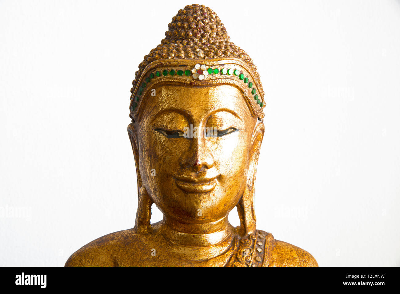 Decorative sculpture of Buddha head in gold color Stock Photo