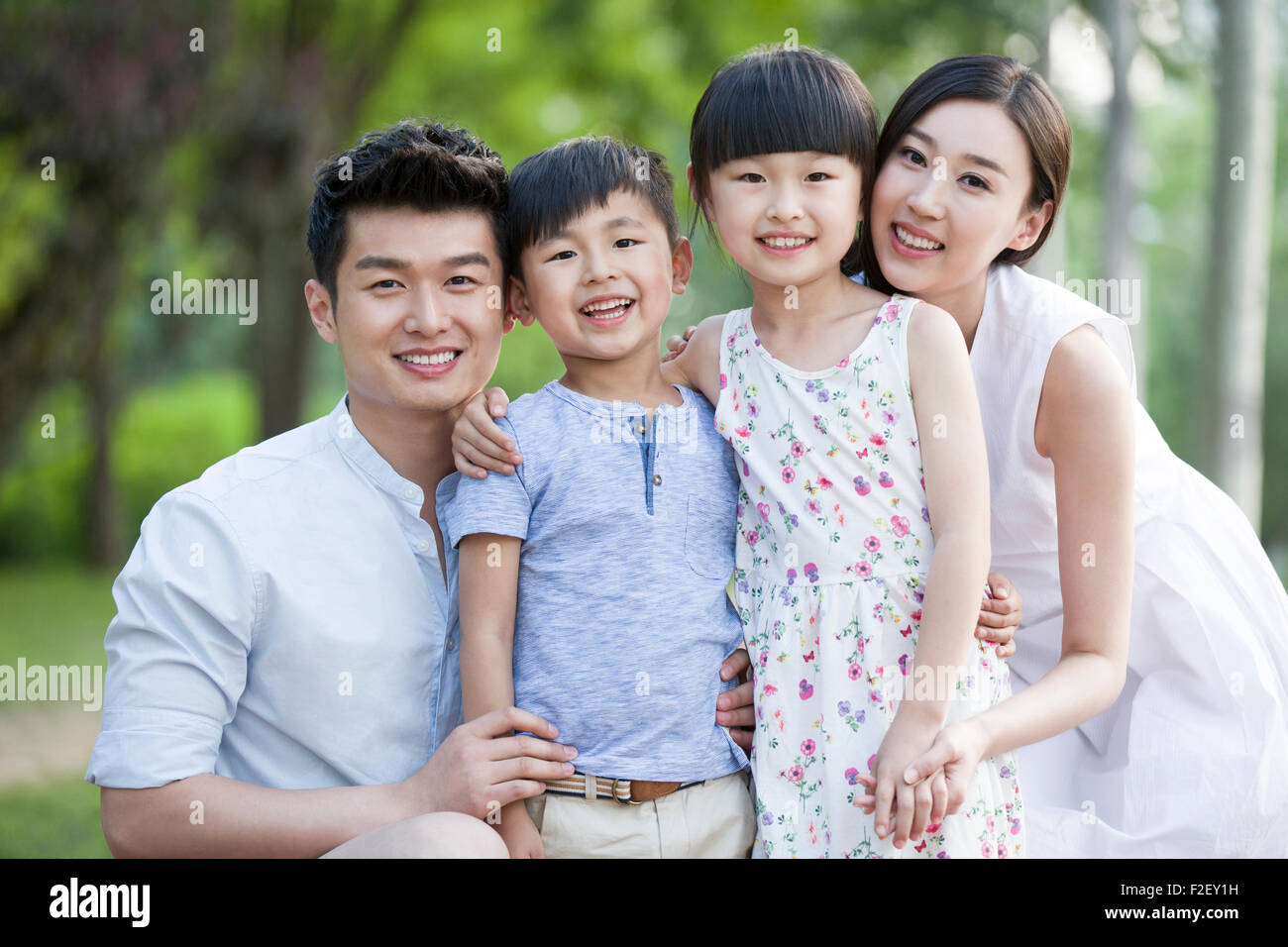 Portrait of happy young family Stock Photo - Alamy