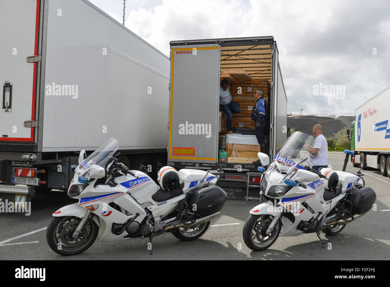 Calais (northern France), August 2014: illegal migrants found by motorcycle policemen Stock Photo
