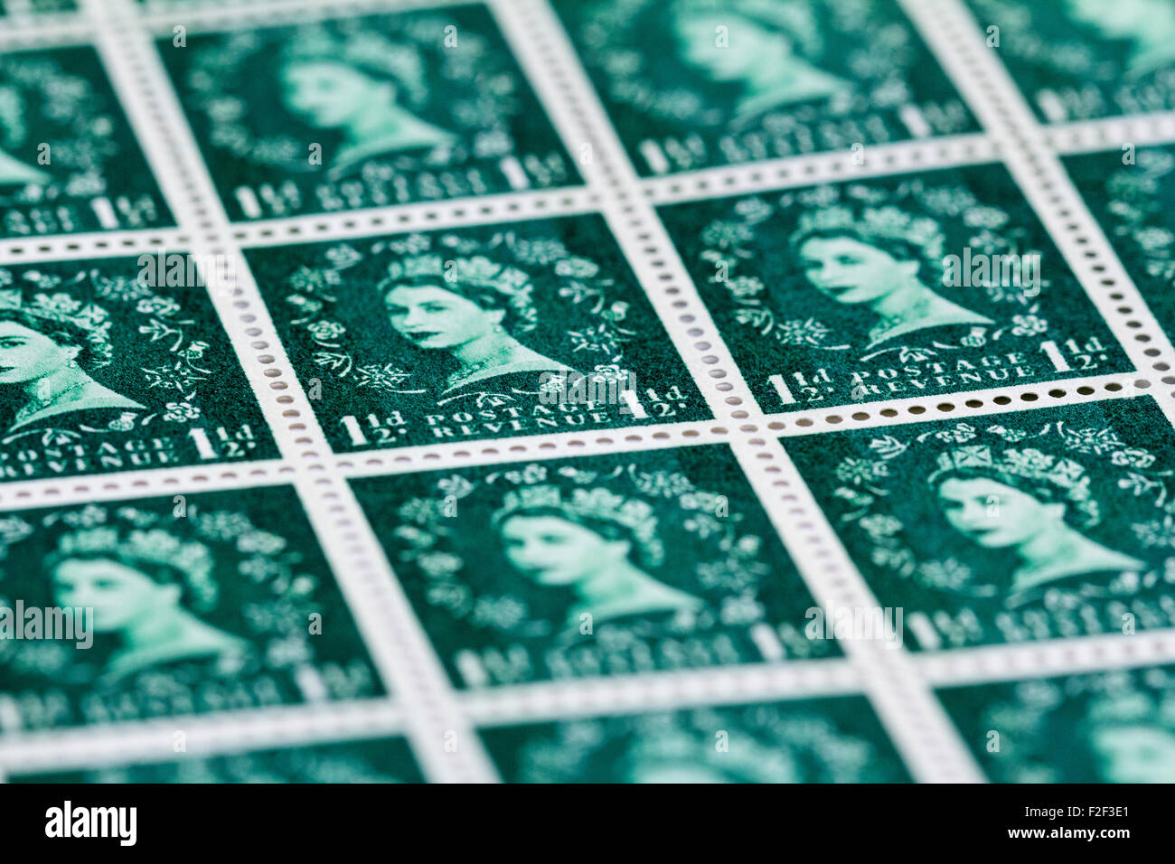 Sheet of 1950's British Royal Mail 1½d green postage stamps from the