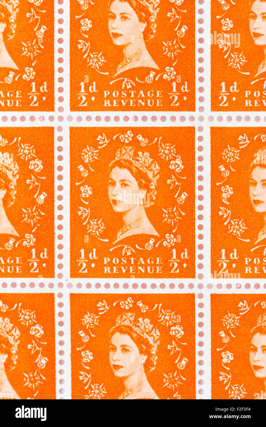 Sheet of 1950's British Royal Mail ½d orange postage stamps from the Wildings definitive issue with portrait of Queen Elizabeth II. Stock Photo