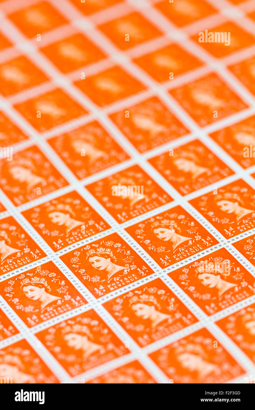 Sheet of 1950's British Royal Mail ½d orange postage stamps from the Wildings definitive issue with portrait of Queen Elizabeth II. Stock Photo