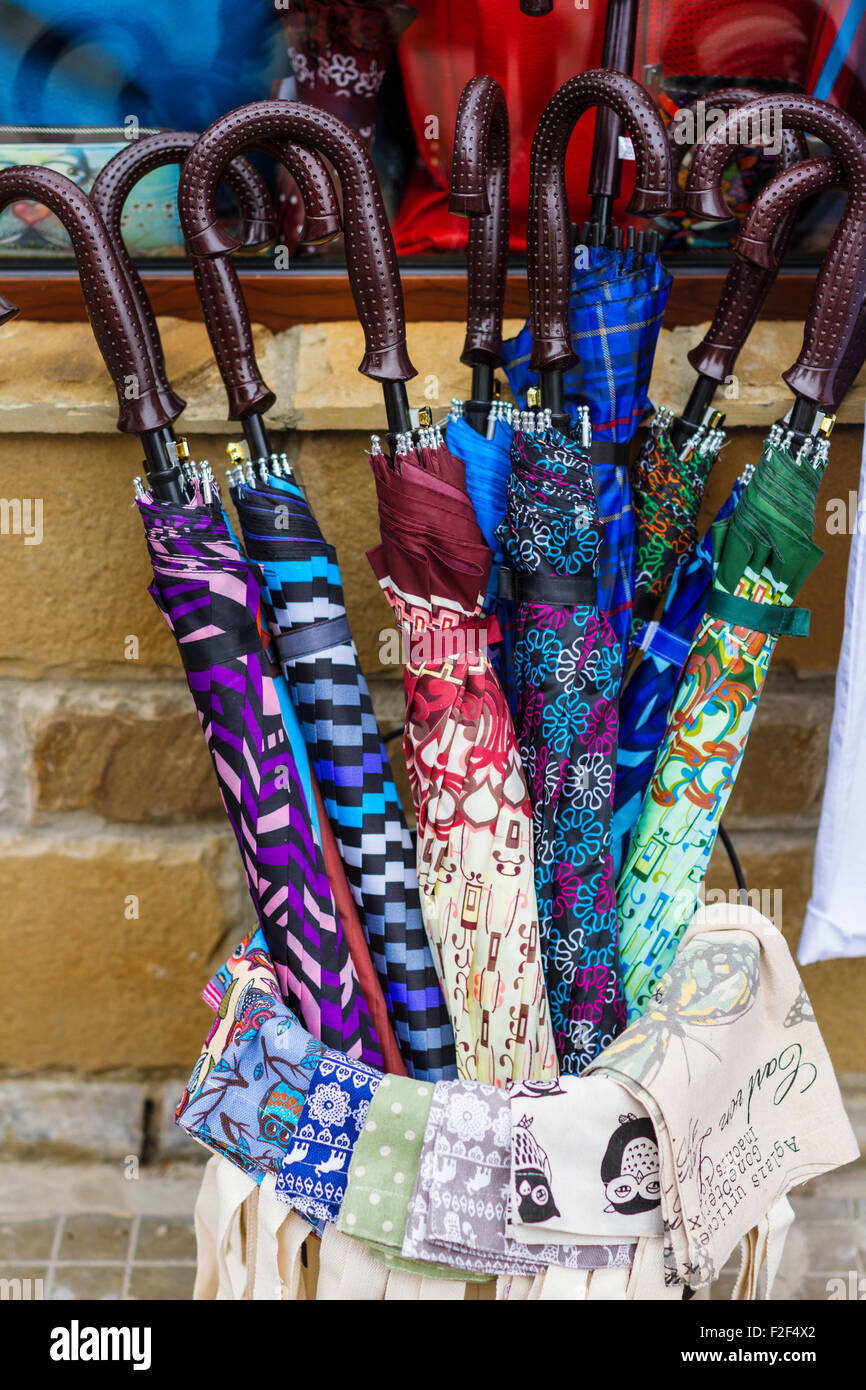 Multi colored umbrella on sale on market place. Stock Photo