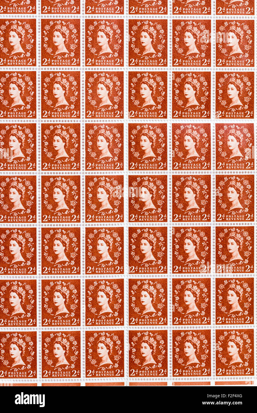 Sheet of 1950's British Royal Mail 2d brown postage stamps from the Wildings definitive issue with portrait of Queen Elizabeth II. Stock Photo