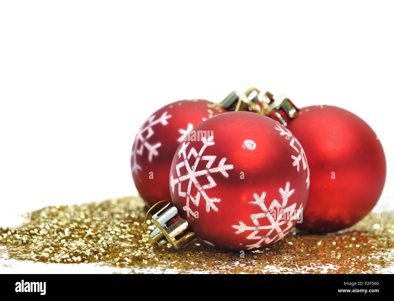 Red christmas balls and gold glitter on white background Stock Photo Alamy