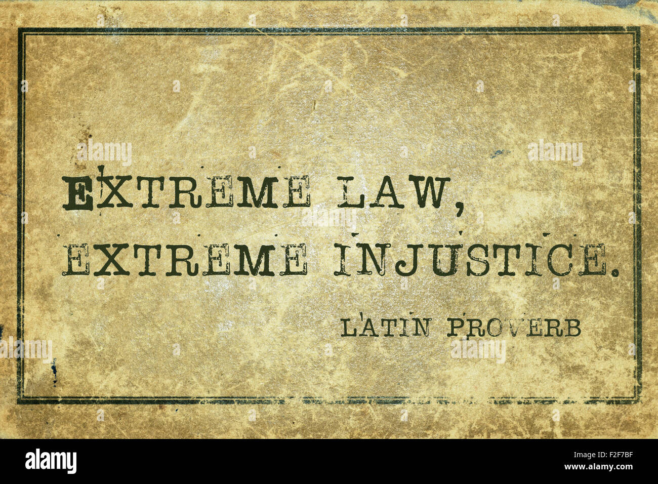 Extreme law, extreme injustice - ancient Latin proverb printed on grunge vintage cardboard Stock Photo