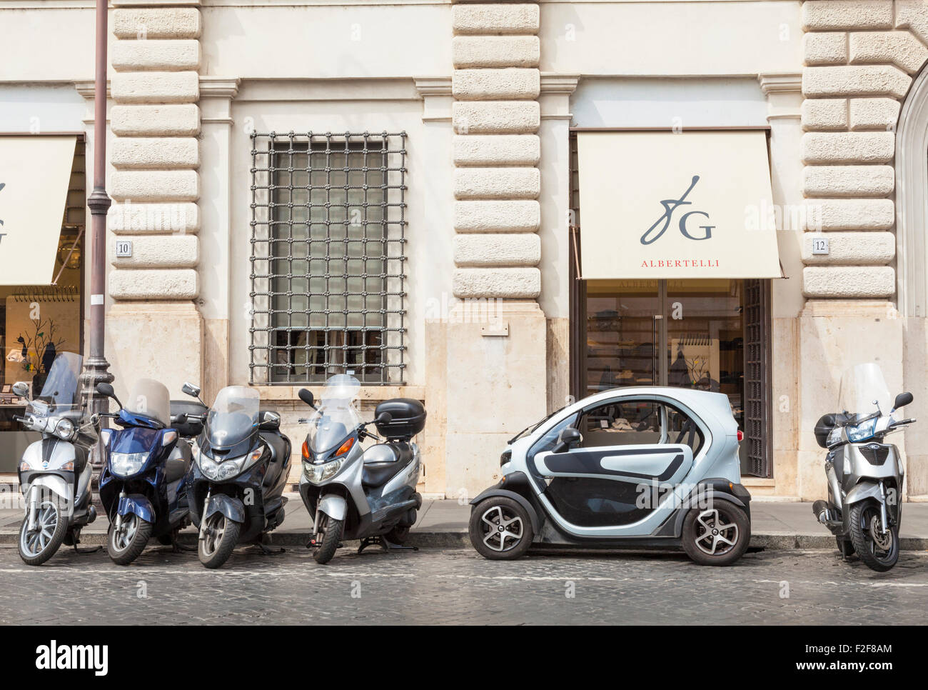 The Renault TWIZY an electric car parked between motorbikes in a small  space Rome Italy Roma Lazio Itlay EU Europe Stock Photo - Alamy