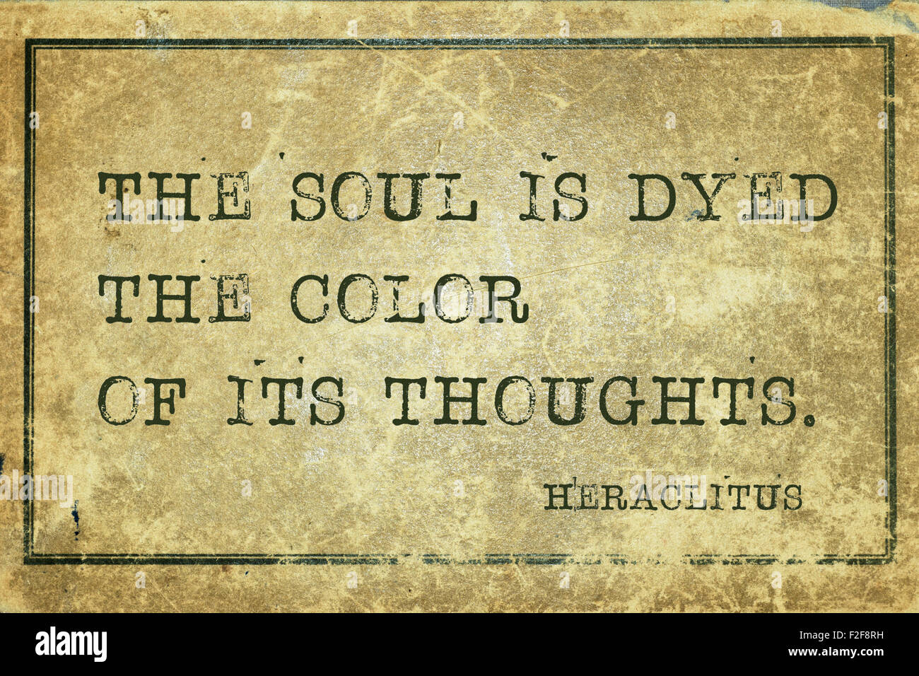 The soul is dyed the color of its thoughts - ancient Greek philosopher Heraclitus quote printed on grunge vintage cardboard Stock Photo