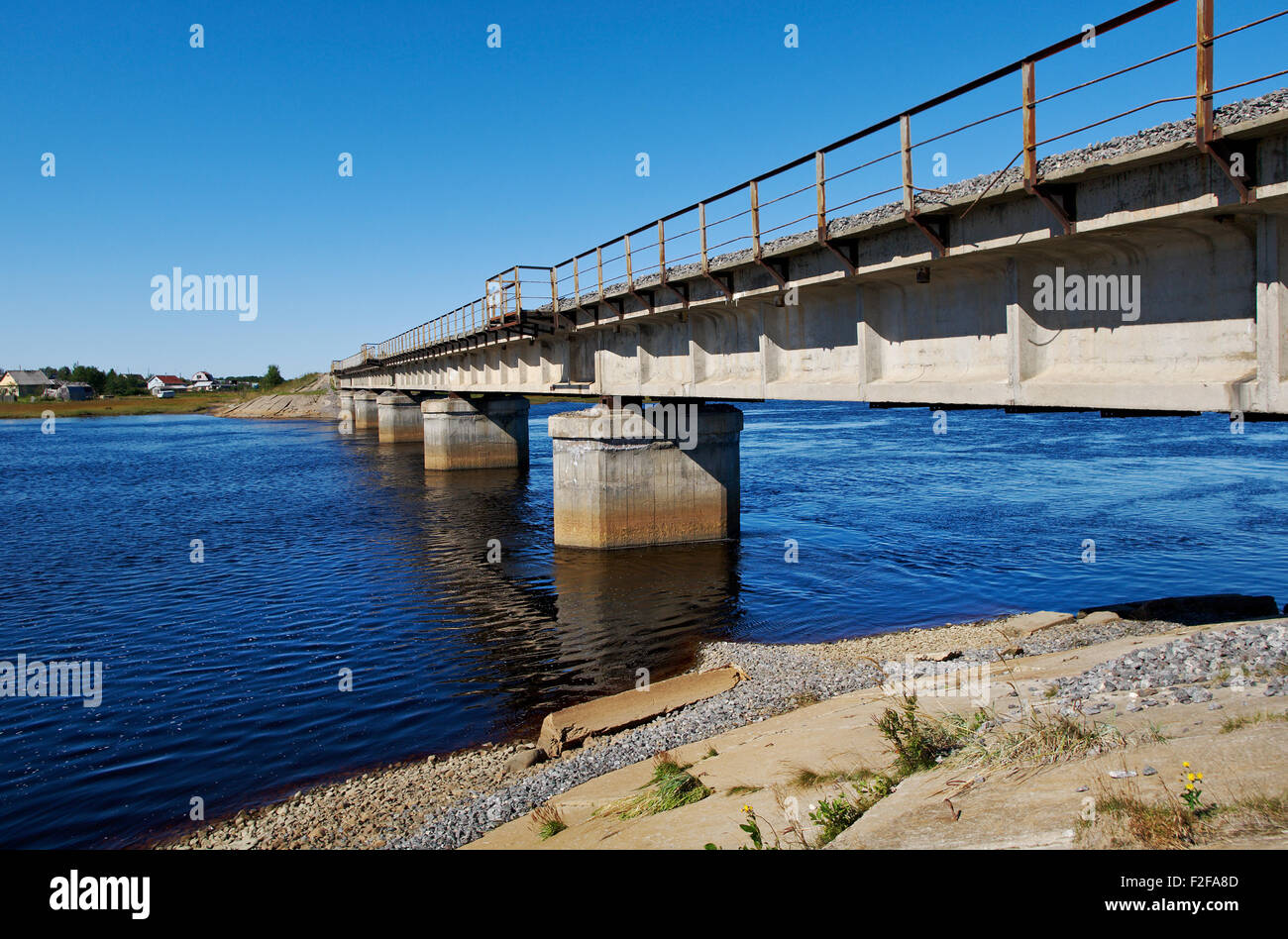 Railroad bridge. river SolzaWhite Sea .Russia, Arkhangelsk region. Stock Photo
