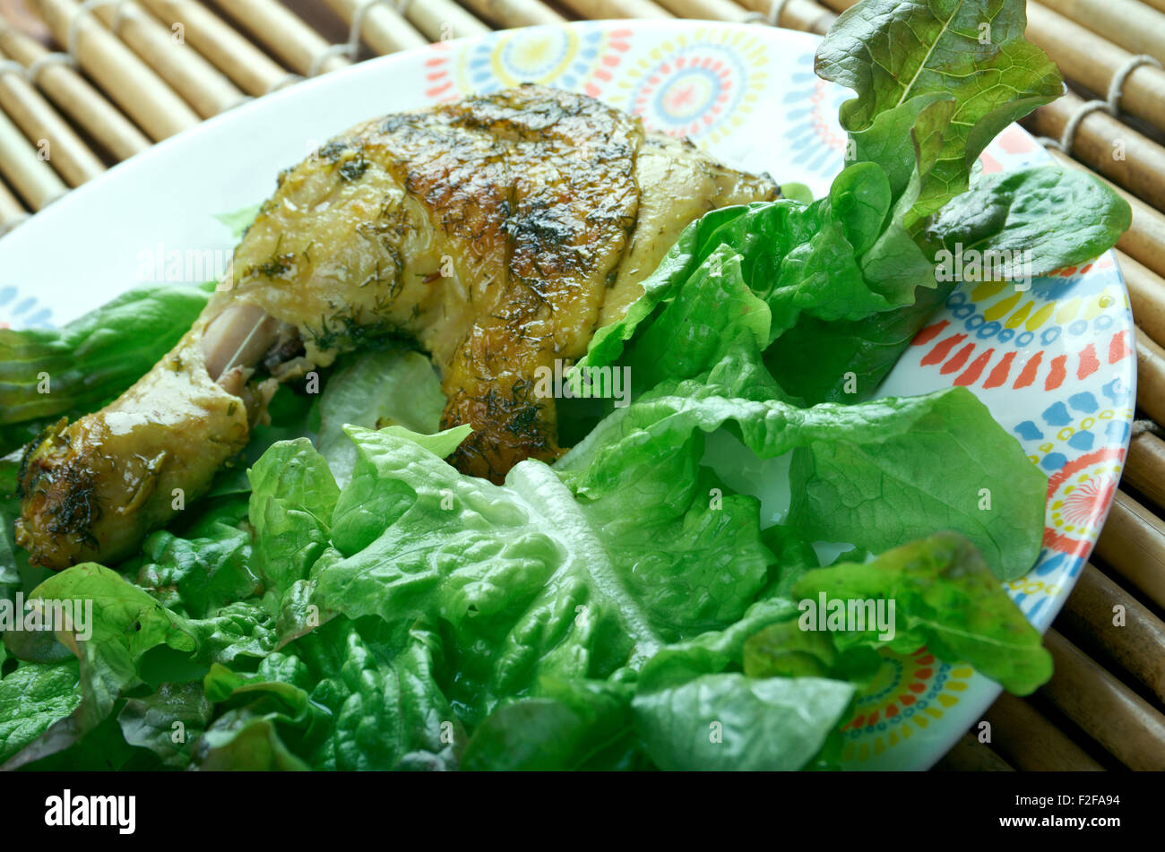 Indian Garlic Chicken served with lettuce Stock Photo