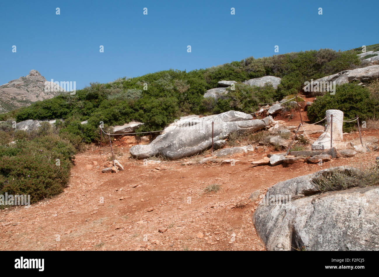 Ancient Greek unfinished statue in quarry above village of Melanes on island of Naxos, Greece Stock Photo