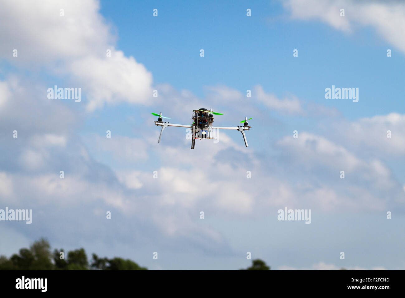Quadcopter in flight Stock Photo