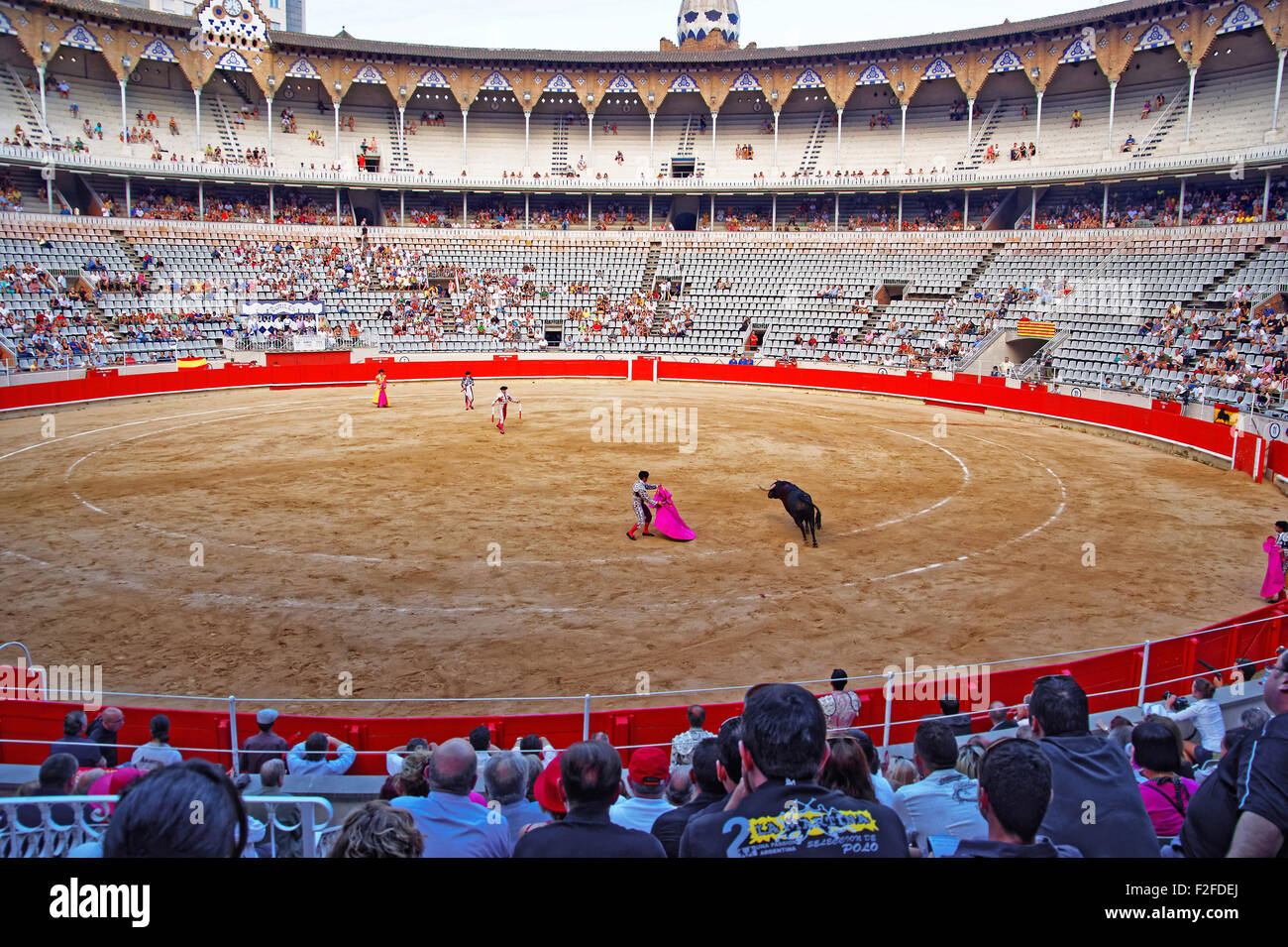 BARCELONA, SPAIN - AUGUST 01, 2010: Spanish torero is performing a bullfight at the bullfighting arena in Barcelona (Spain). 'Co Stock Photo