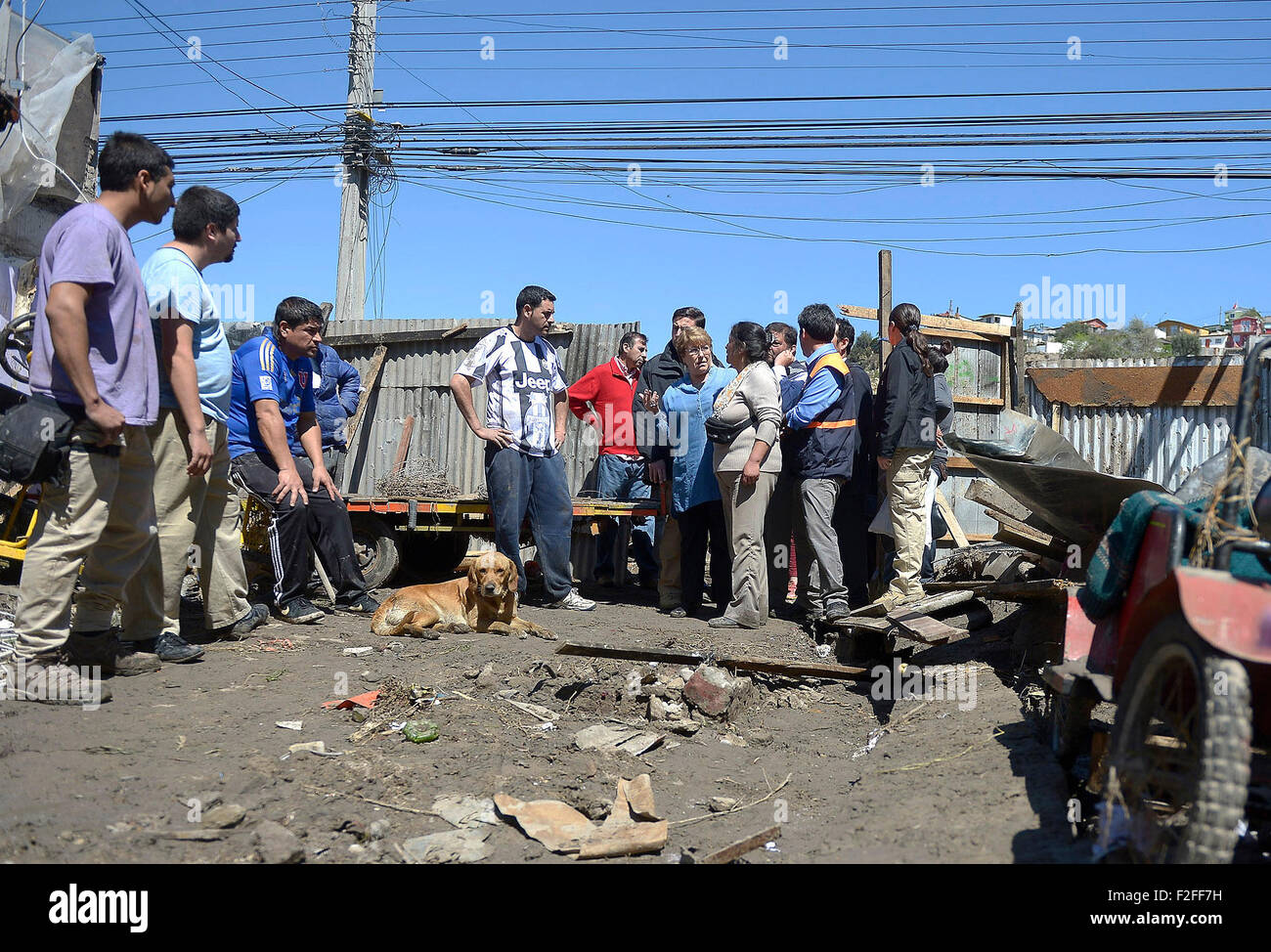 Coquimbo, Chile. 17th Sep, 2015. Image provided by Chile's Presidency shows Chilean President Michelle Bachelet (4th R, front) inspecting the coastal area in Coquimbo City, Chile, Sept. 17, 2015. The coastal area in Coquimbo City was damaged by the tsunami following the recent earthquak. The earthquake has so far left ten people dead, according to the Chile's National Office for Emergencies of the Ministry of Interior and Public Security (ONEMI), in addition to the evacuation of a million people. Credit:  Sebastian Rodriguez/Chile's Presidency/Xinhua/Alamy Live News Stock Photo
