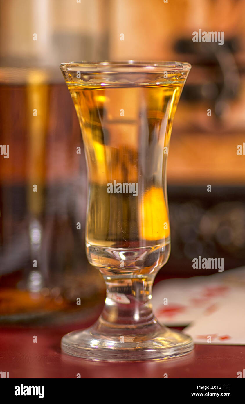 Rum poured into a glass. Stock Photo